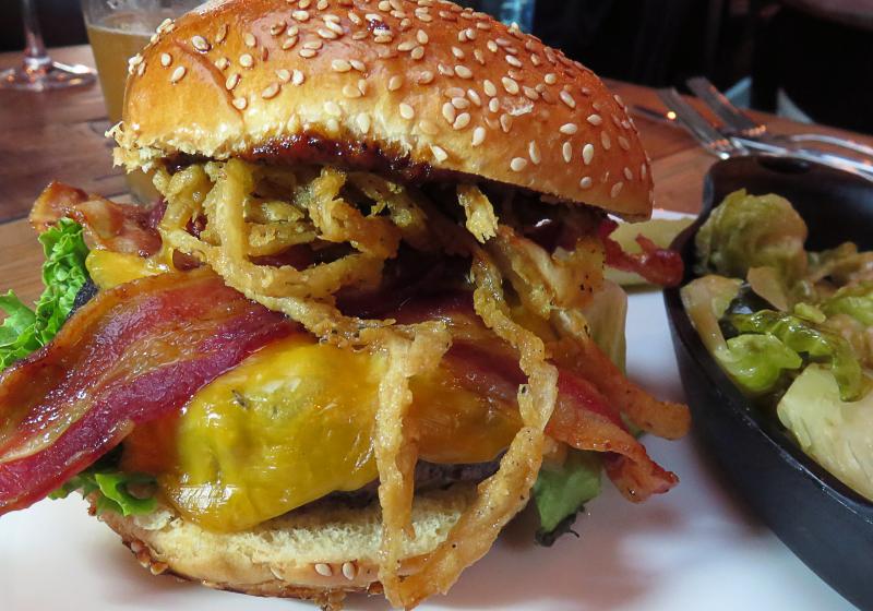 The Blackwall at the Beach burger presents tall and sassy with white cheddar, a fried green tomato, bacon, lettuce and onions on an onion-sesame seed bun. Zack and Derek will kill me for this, but if you ask politely, they might top this beefy tower with crispy onion frizzles. BOB YESBEK PHOTO